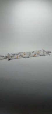 Pulsera onda dorada metal y borlas 2