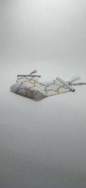 Pulsera onda dorada metal y borlas 1